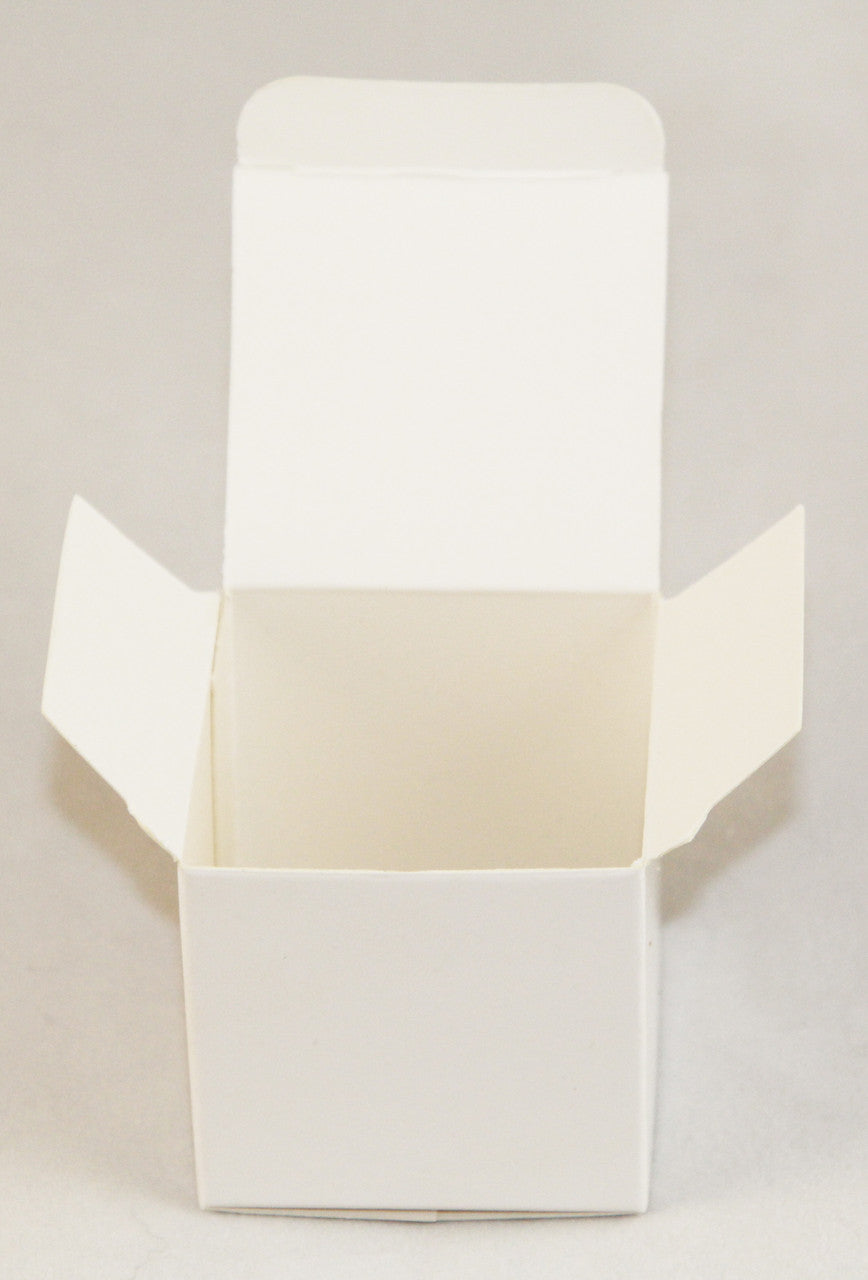 A pack of 10 white 5cm square cube gift boxes, ideal for weddings and events, neatly folded and ready for assembly.