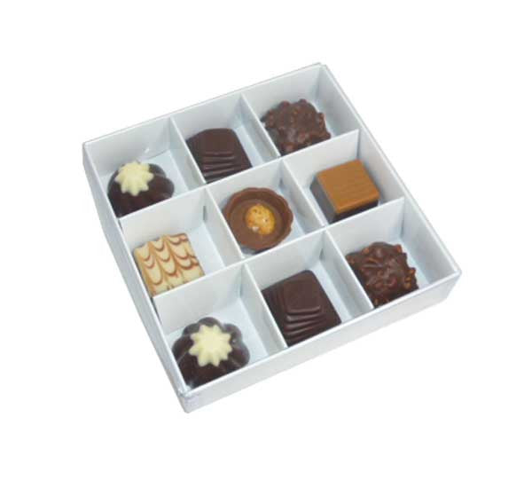 A set of 10 white gift boxes with clear plastic lids, designed for chocolates and small gifts, showcasing elegant compartments.