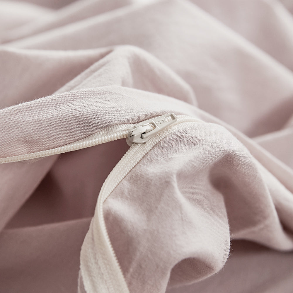 100% washed cotton quilt cover set in pink, featuring a soft and plush texture, perfect for a cozy bedroom aesthetic.