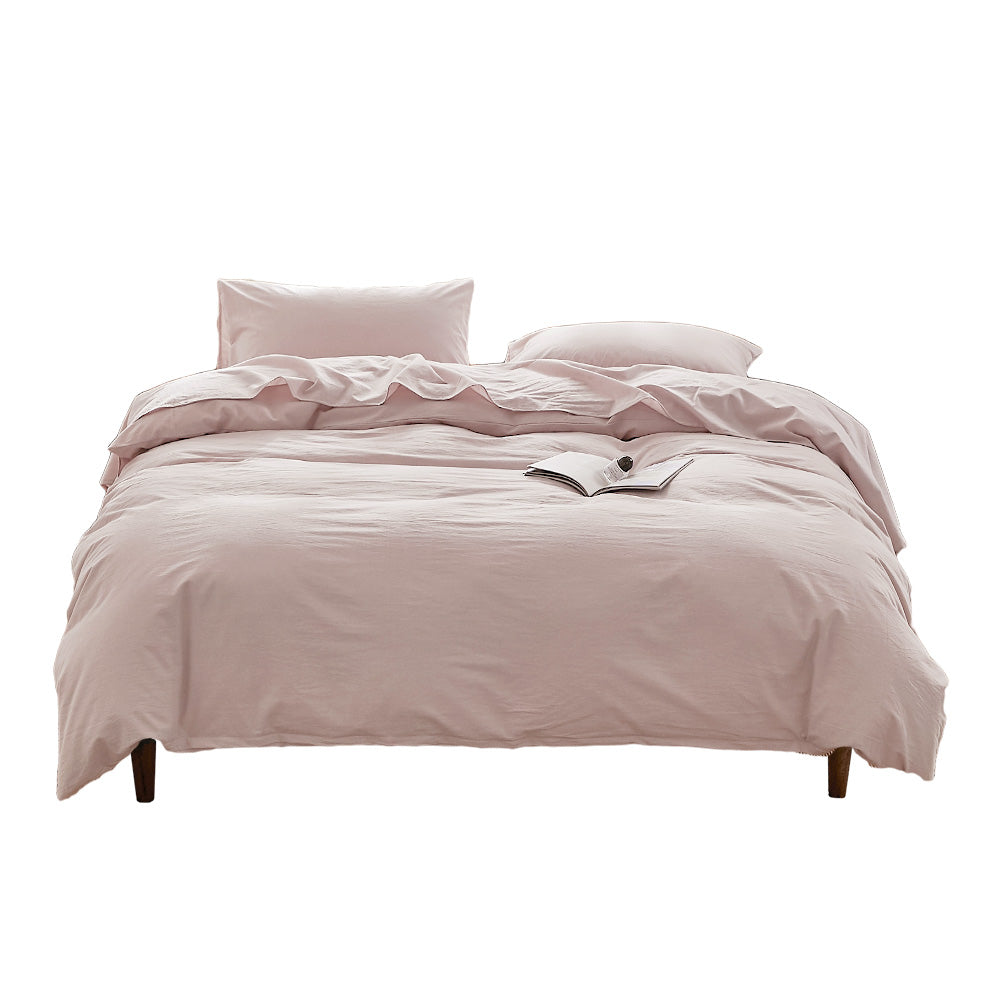 100% washed cotton quilt cover set in pink, featuring a soft and plush texture, perfect for a cozy bedroom aesthetic.