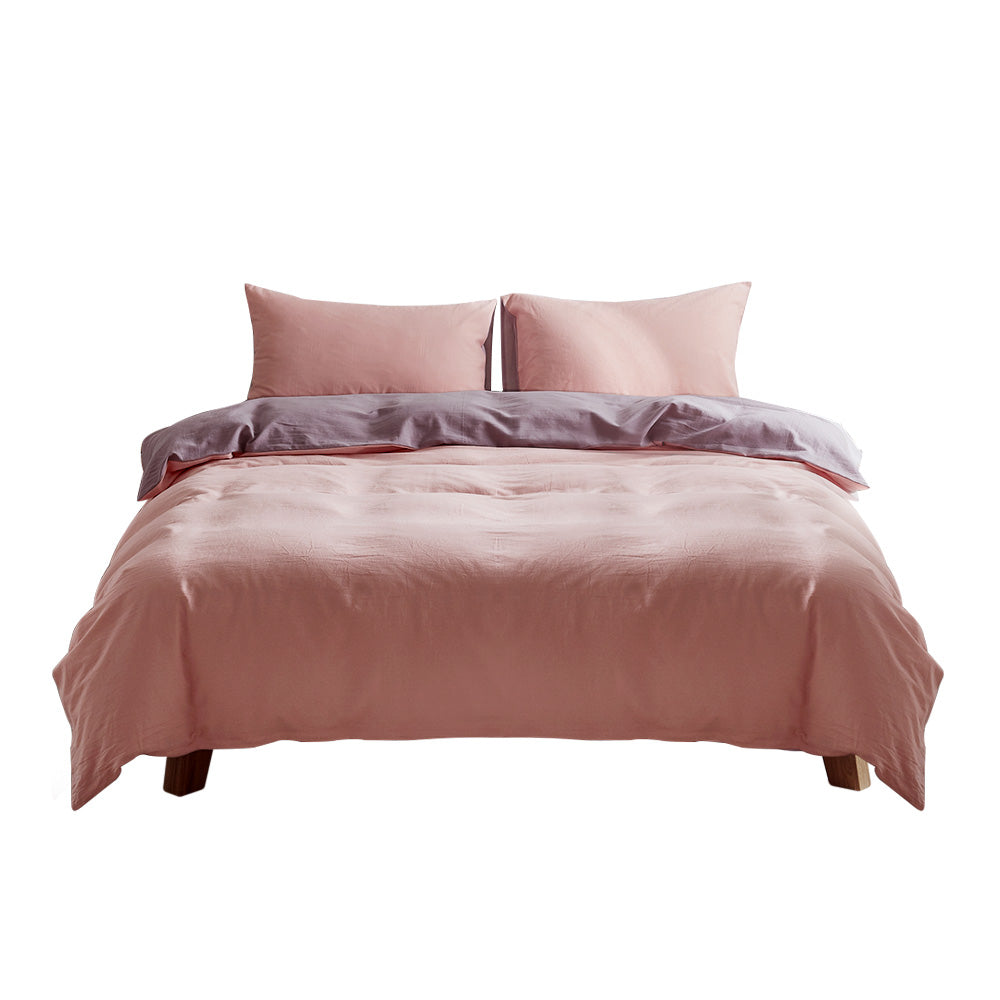 100% washed cotton quilt set in pink and purple, featuring a textured design and lightweight fabric, perfect for cozy bedding.