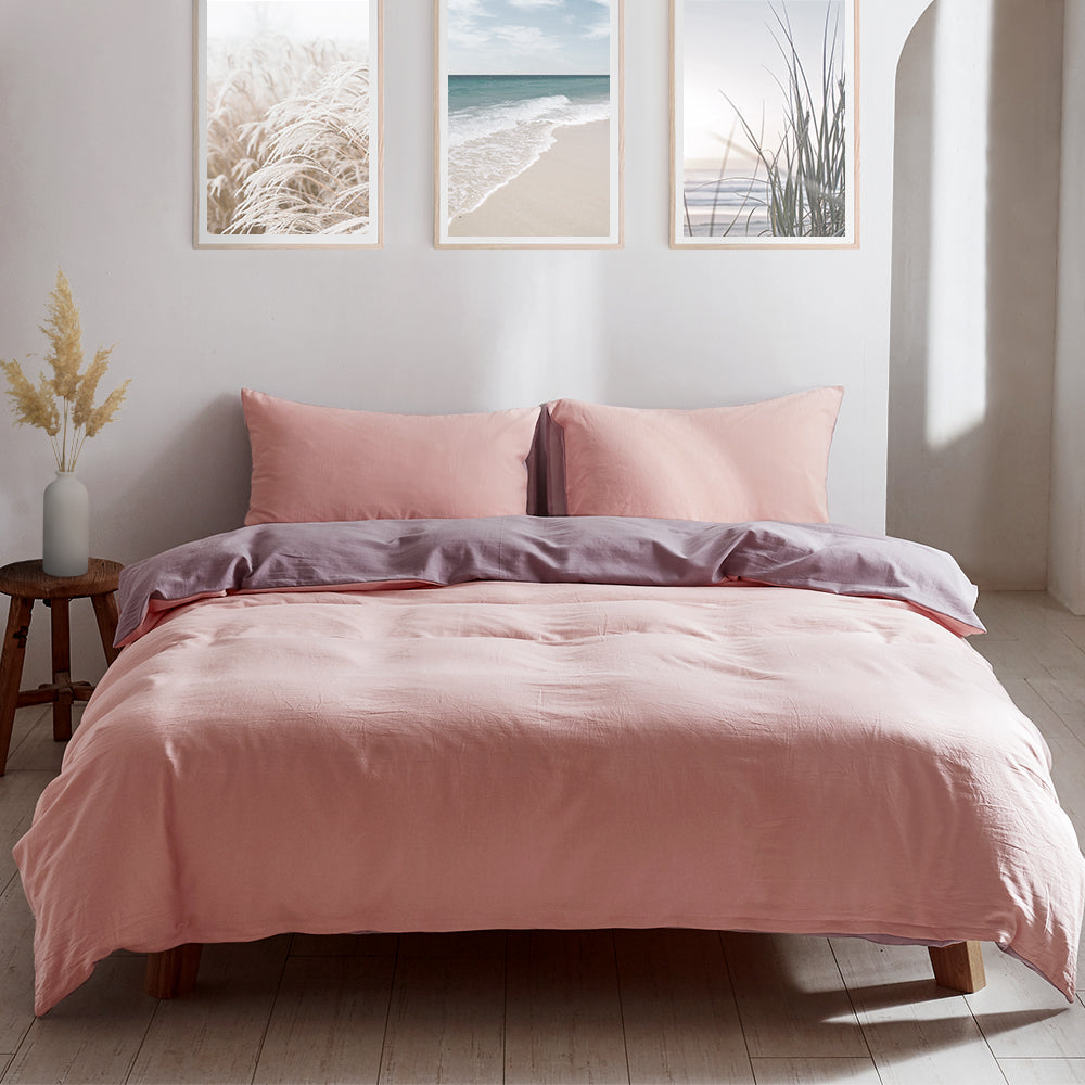 100% washed cotton quilt set in pink and purple, featuring a textured design and lightweight fabric, perfect for cozy bedding.