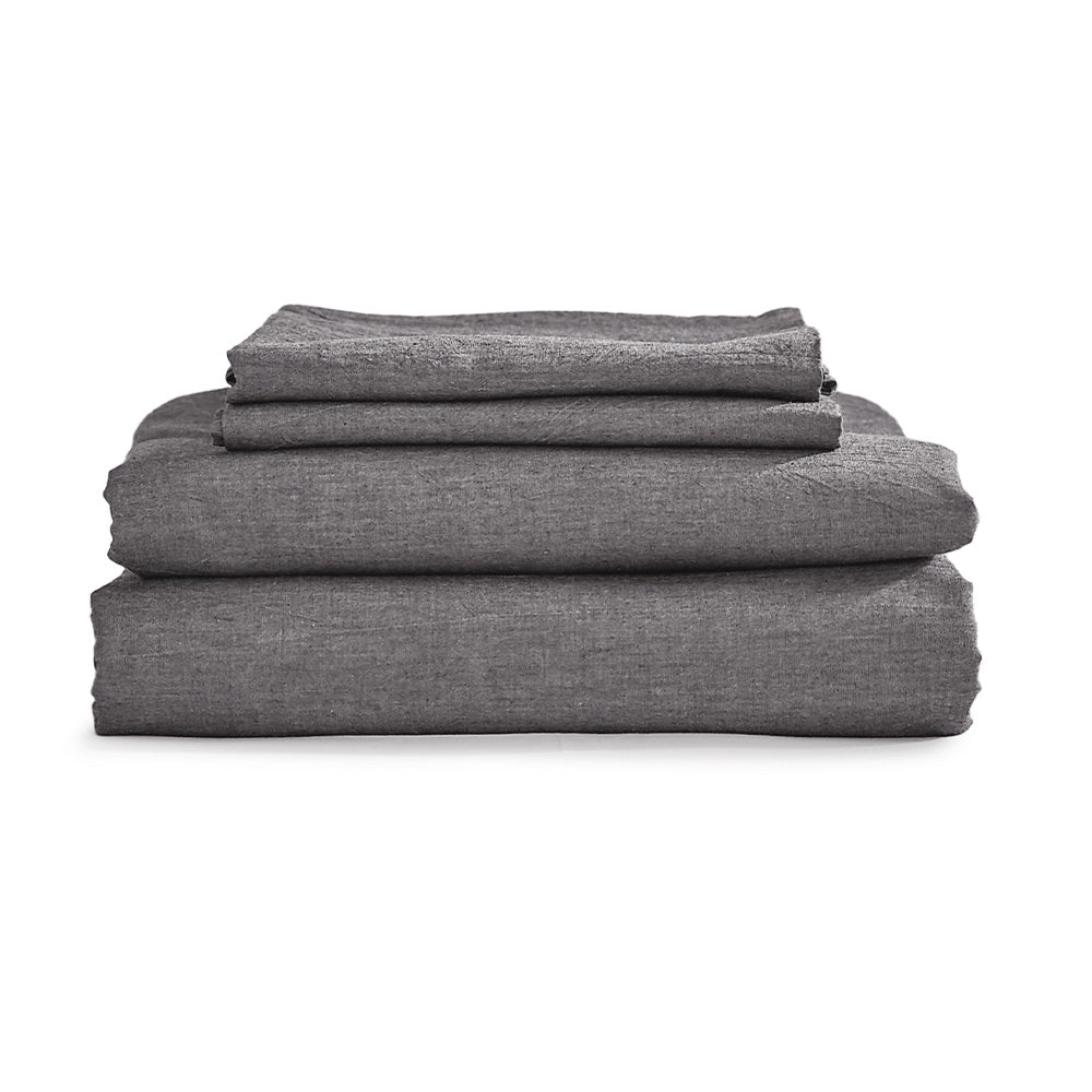 100% washed cotton sheet set in black, featuring a flat sheet, fitted sheet, and two pillowcases, showcasing a soft and breathable texture.