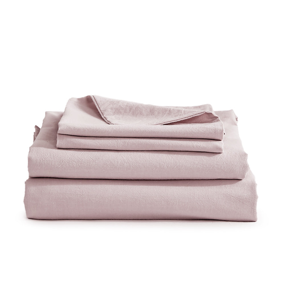 100% washed cotton sheet set in purple, featuring a flat sheet, fitted sheet, and two pillowcases, showcasing a soft and breathable texture.