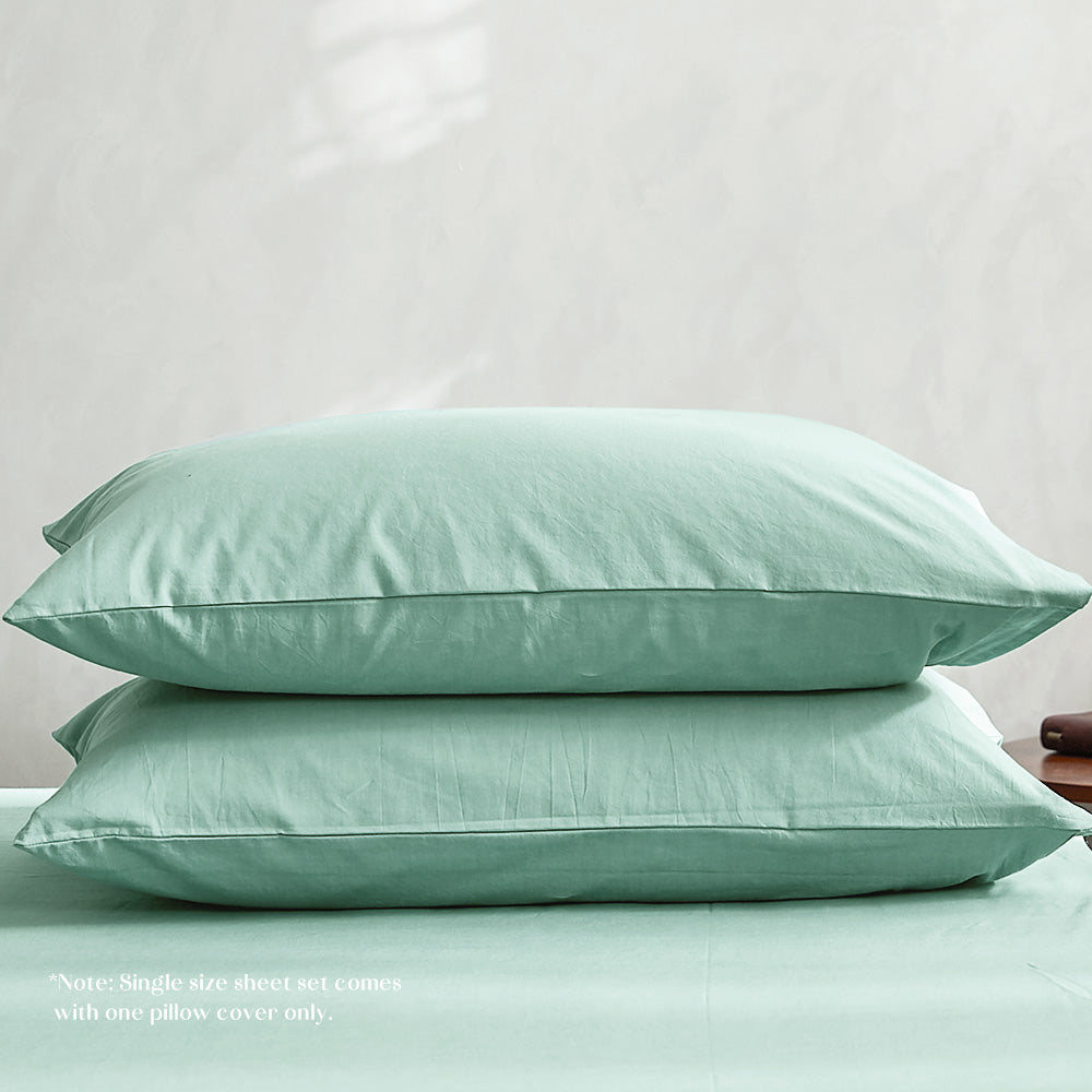 100% washed cotton sheet set in single green, featuring a soft texture and lightweight design, perfect for year-round comfort.