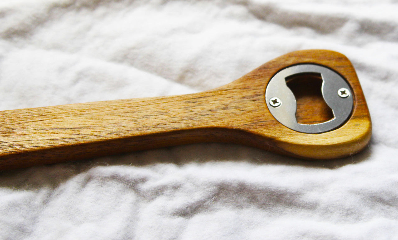 A set of 10 wooden spoon bottle openers with leather hang straps, showcasing their natural wood finish and practical design.