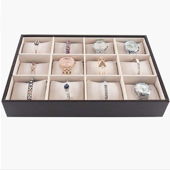 Black 12 Bracelet Storage Tray with 12 compartments and pillows for displaying bracelets elegantly.