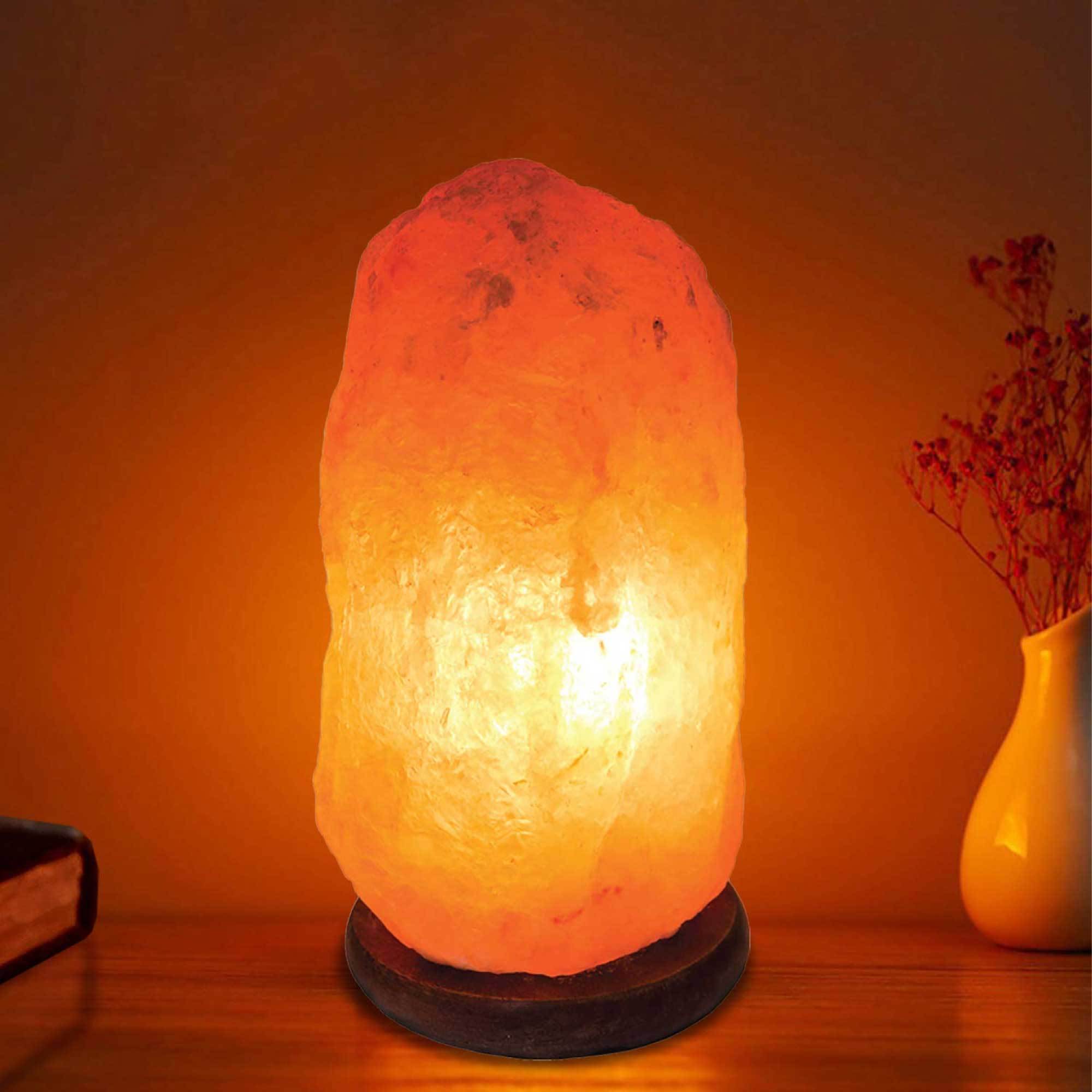 A beautifully handcrafted 12V 12W Himalayan Pink Salt Lamp with a wooden base, showcasing its natural rock crystal texture and warm glow.