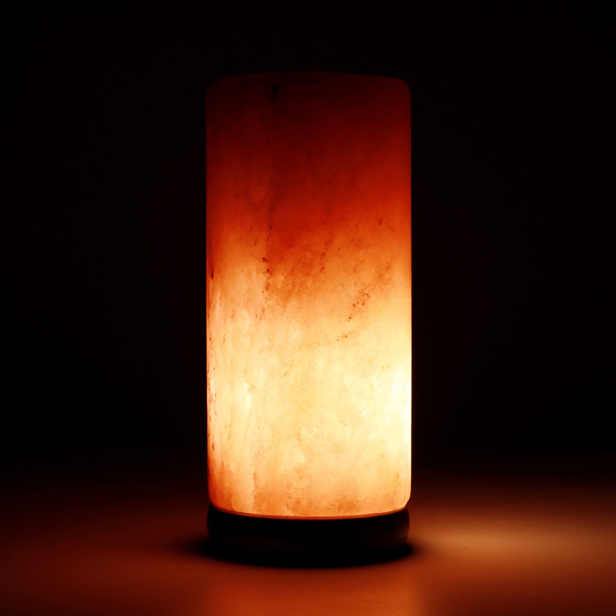 A beautifully handcrafted 12V 12W Cylinder Himalayan Pink Salt Lamp with a wooden base, emitting a warm glow.