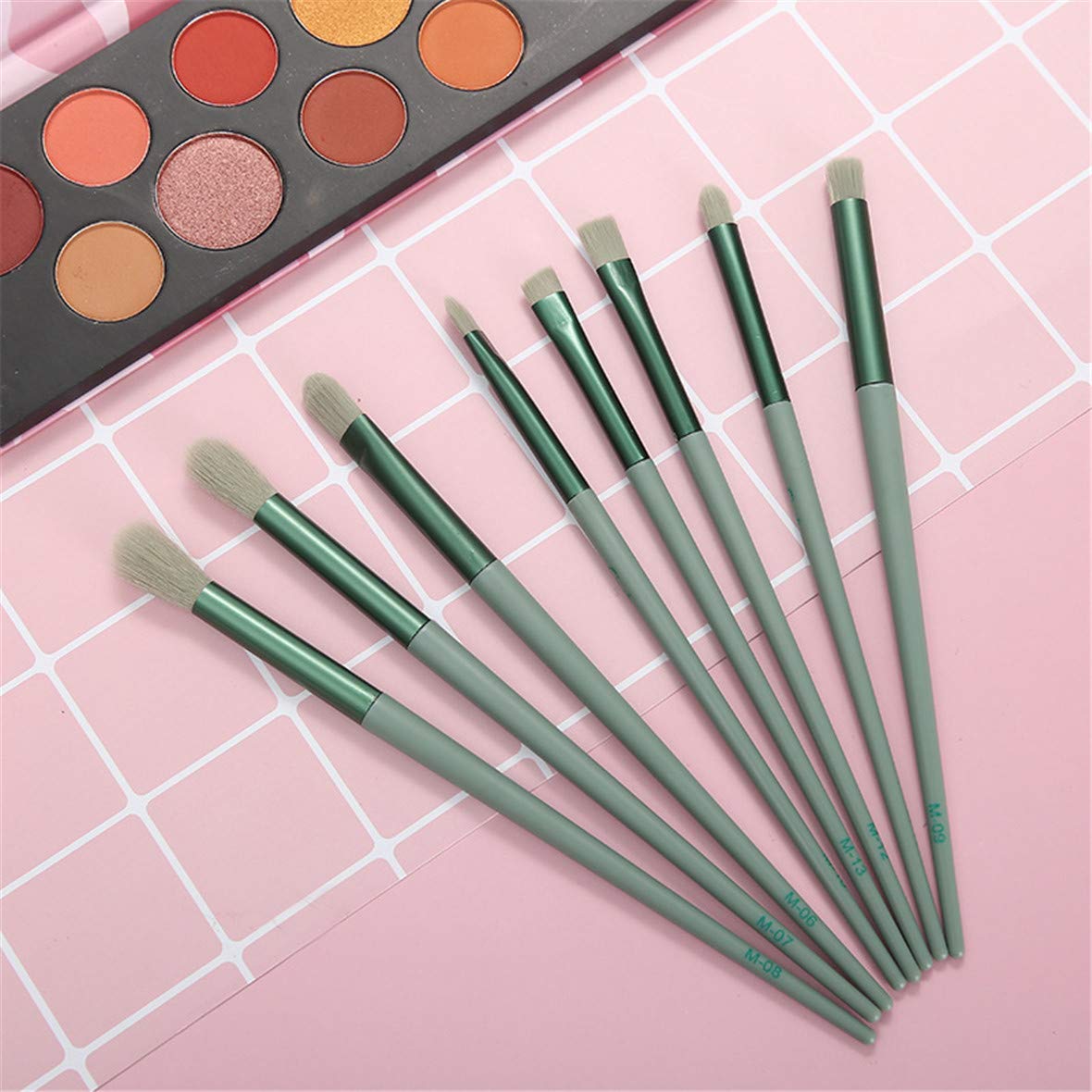 A complete set of 13 makeup brushes displayed in a portable bag, showcasing various brush types for foundation, blending, and eye makeup.