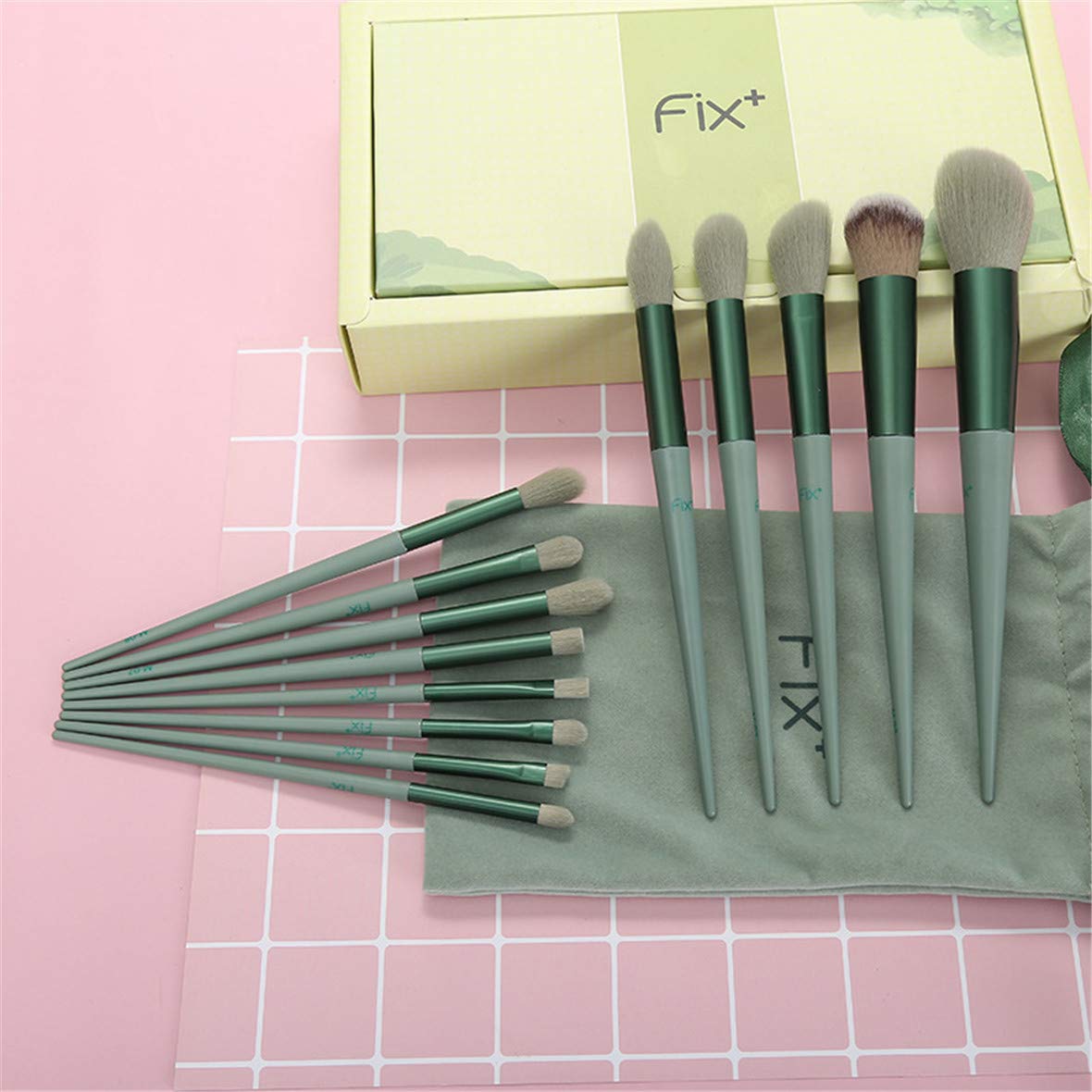 A complete set of 13 makeup brushes displayed in a portable bag, showcasing various brush types for foundation, blending, and eye makeup.