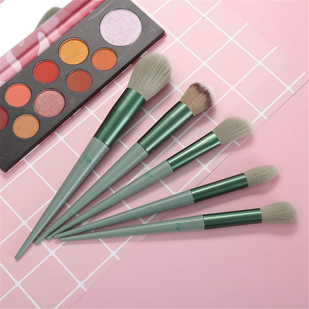 A complete set of 13 makeup brushes displayed in a portable bag, showcasing various brush types for foundation, blending, and eye makeup.