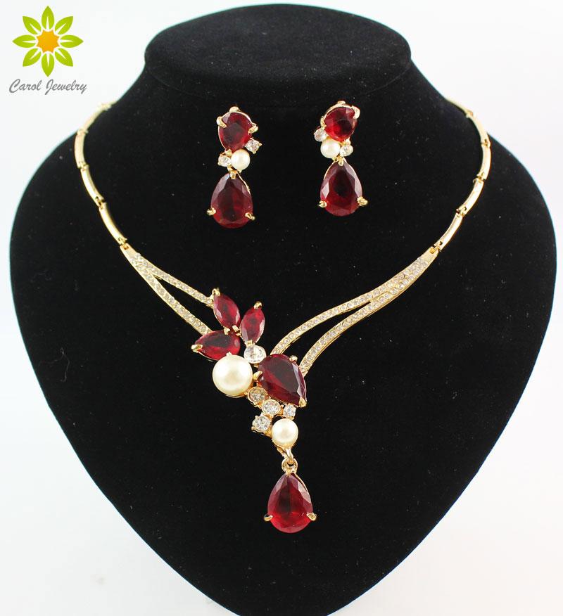 A collection of 18K gold plated crystal pendants featuring black, blue, red, and purple zircon beads, showcasing their vibrant colors and elegant design.