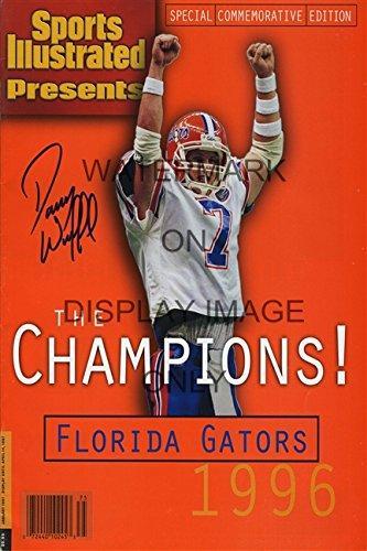 1996 Florida Gators Sports Illustrated print, featuring vibrant colors and a printed signature, framed in black.