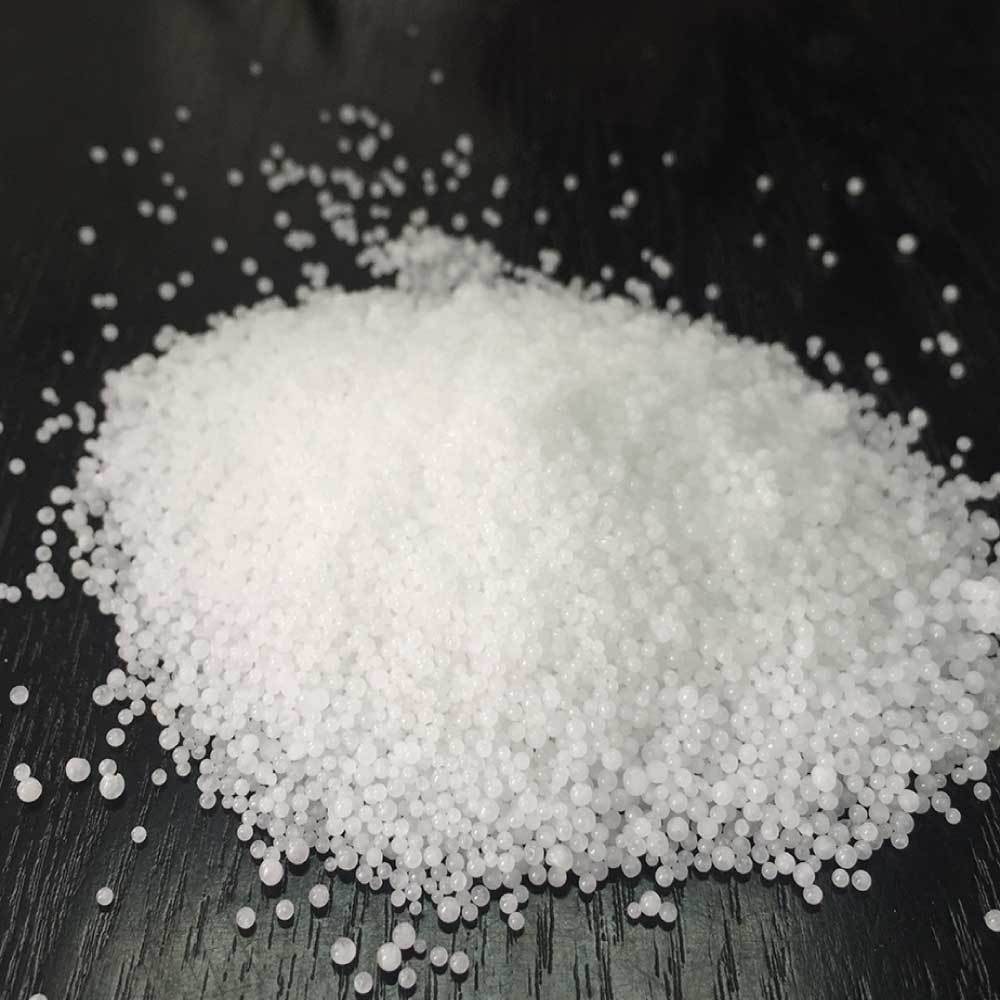 1Kg bag of Caustic Soda Pearls, white translucent beads used for soap making and cleaning.