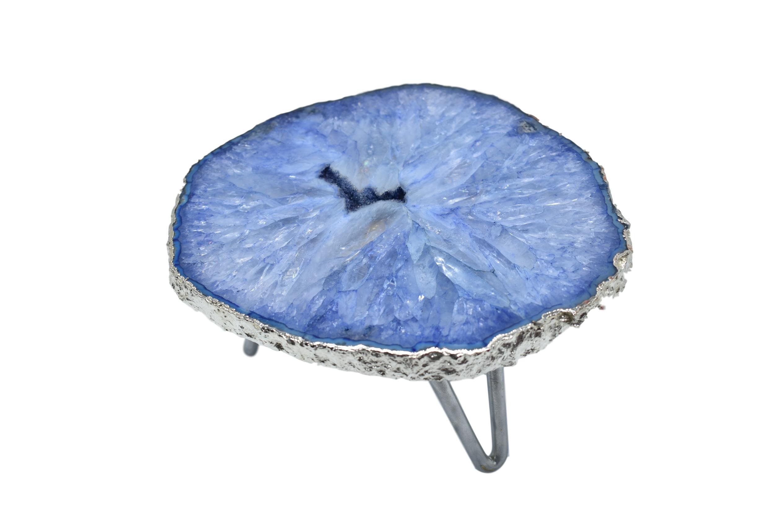 A stunning 1-layer cake stand featuring unique white quartz or pastel blue agate with elegant silver trim and three silver legs.