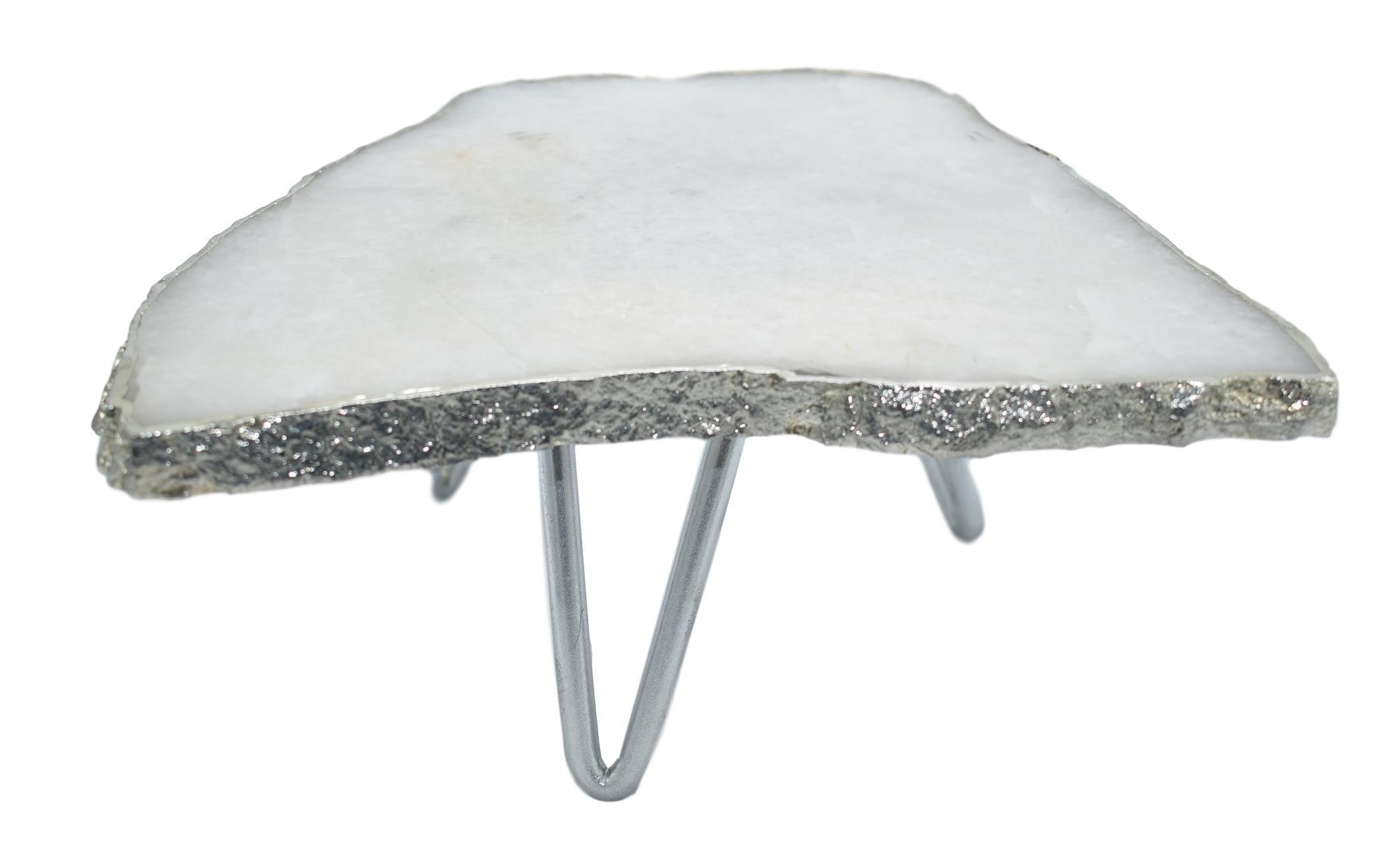 A stunning 1-layer cake stand featuring unique white quartz or pastel blue agate with elegant silver trim and three silver legs.