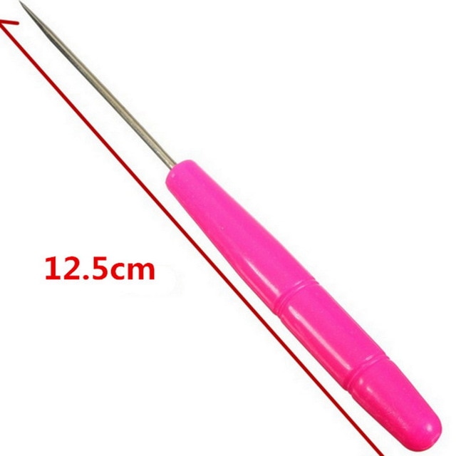 Pink-handled metal sewing awl.