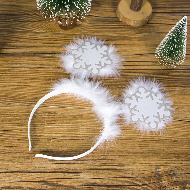 Merry Christmas headband featuring festive antlers and snowflake decorations, perfect for holiday celebrations.