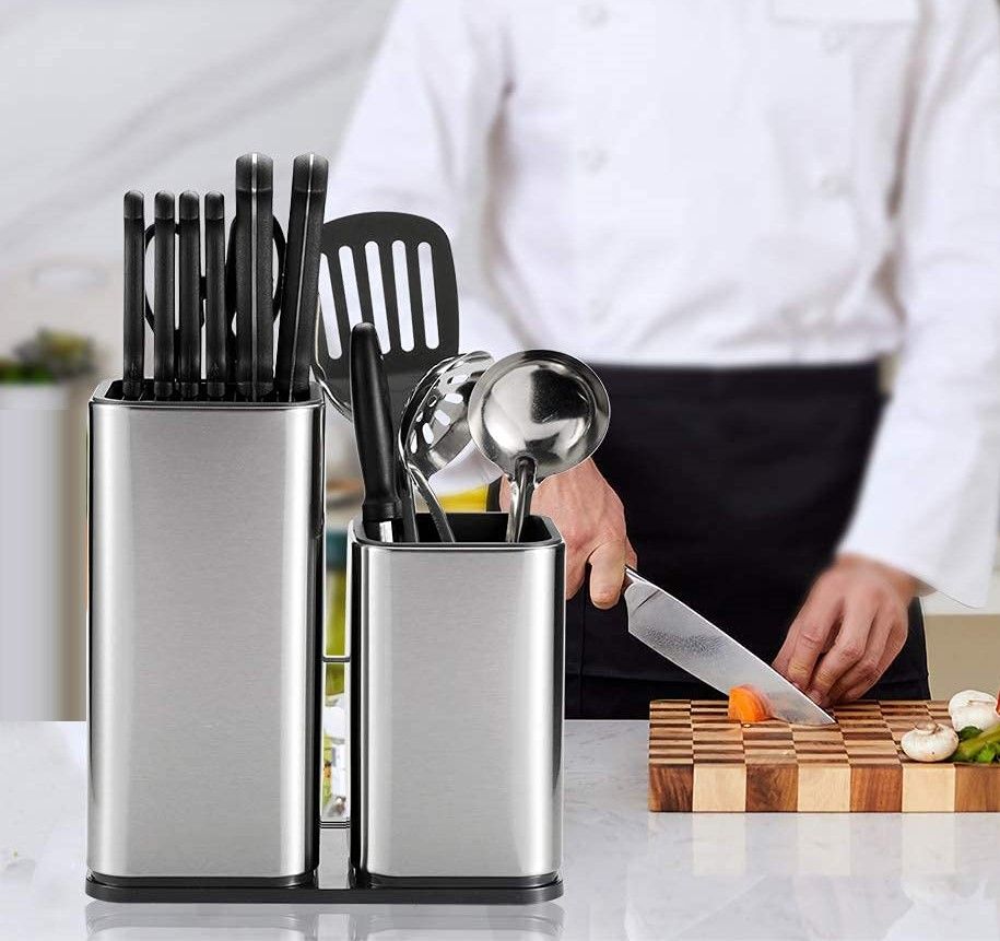 A sleek 2 in 1 stainless steel knife holder with space for 12 knives and kitchen scissors, featuring a modern design and anti-fingerprint coating.