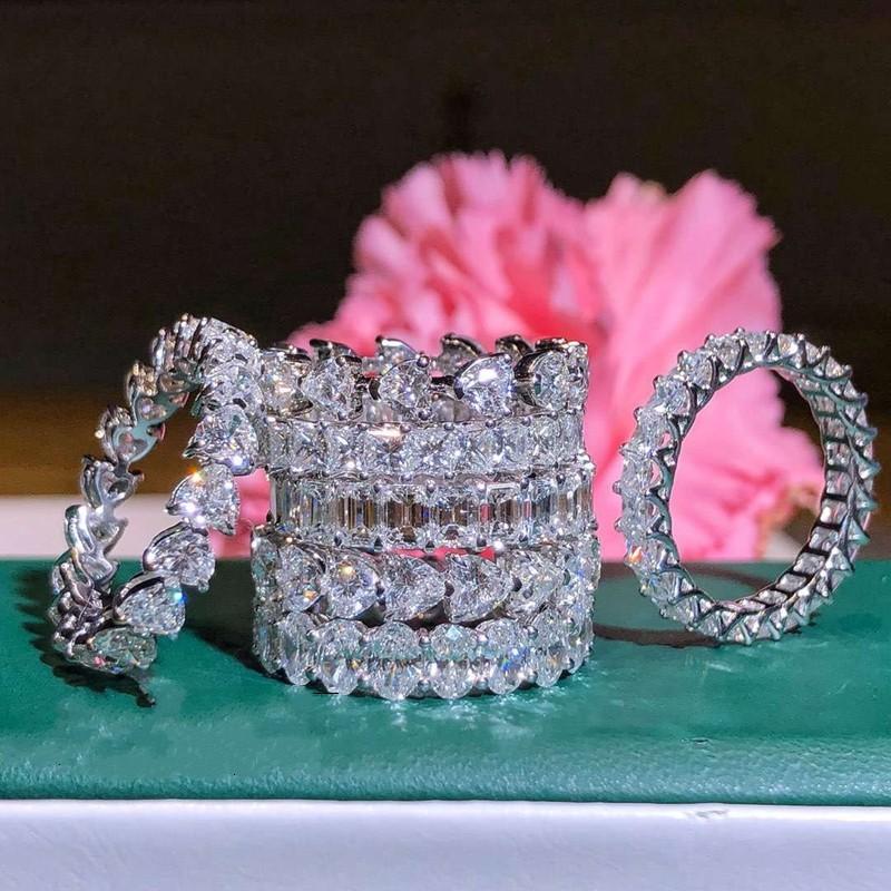 Elegant 2019 Top Selling Luxury Jewelry ring made of 925 Sterling Silver with White Topaz stones, showcasing intricate design and craftsmanship.