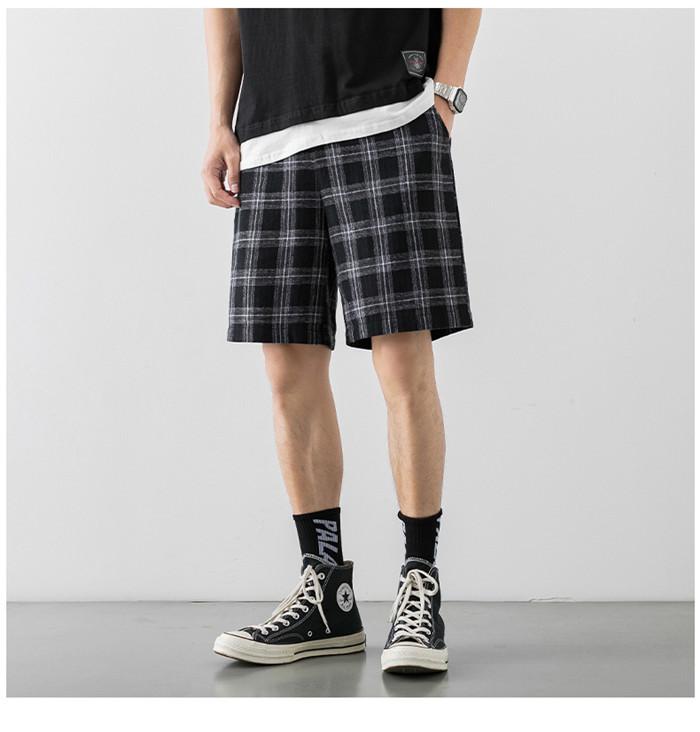 2020 Japanese Style Men's Grid Shorts in a casual setting, showcasing the lightweight polyester material and stylish design.