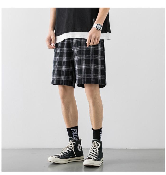 2020 Japanese Style Men's Grid Shorts in a casual setting, showcasing the lightweight polyester material and stylish design.