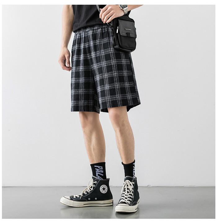 2020 Japanese Style Men's Grid Shorts in a casual setting, showcasing the lightweight polyester material and stylish design.