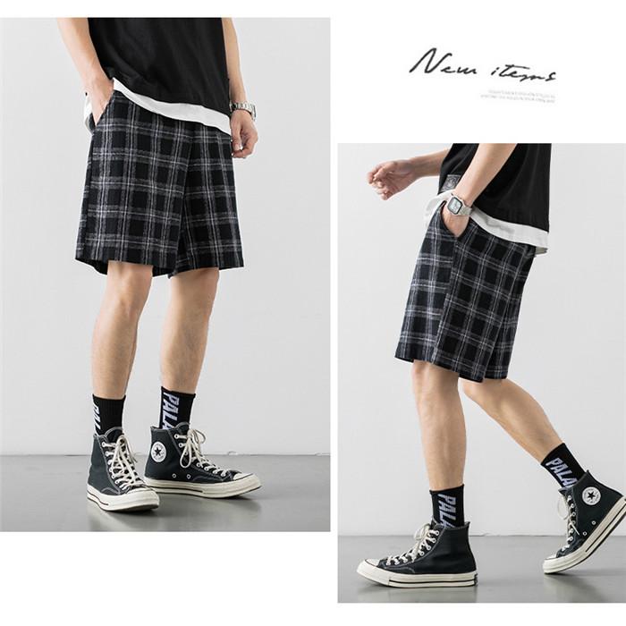 2020 Japanese Style Men's Grid Shorts in a casual setting, showcasing the lightweight polyester material and stylish design.