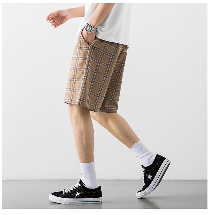 2020 Japanese Style Men's Grid Shorts in a casual setting, showcasing the lightweight polyester material and stylish design.