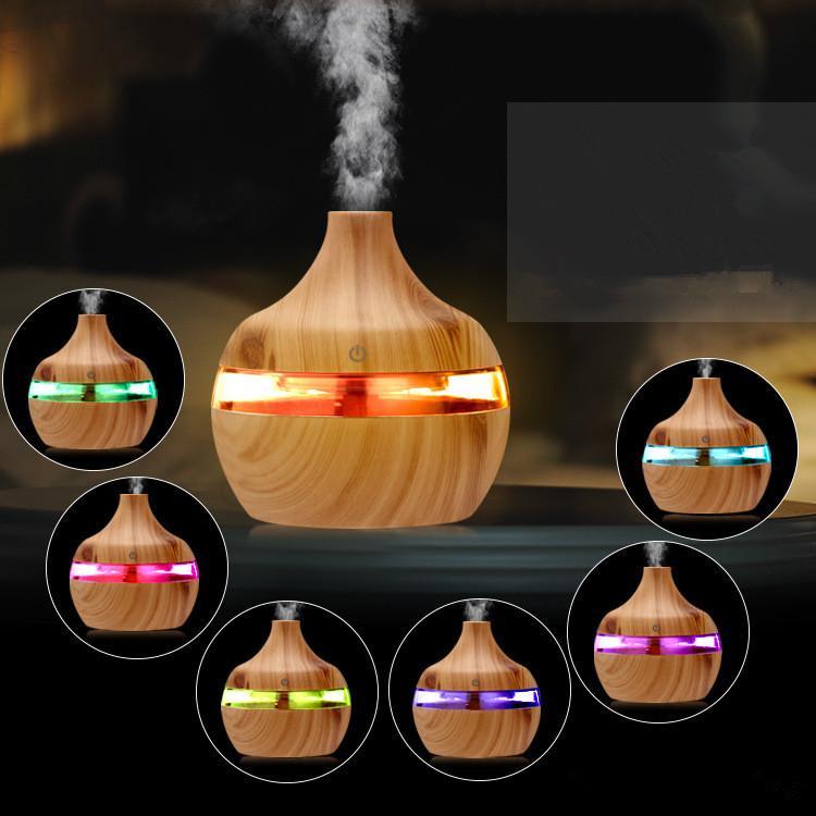 2020 Aromatherapy Essential Oil Diffuser in bamboo wood grain finish, featuring 7 LED lights and ultrasonic mist technology.