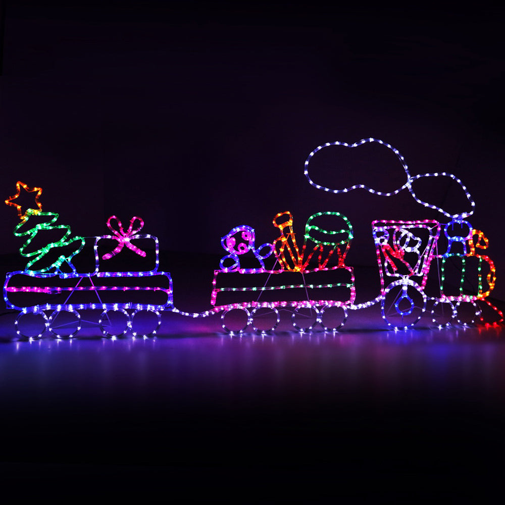 A beautifully illuminated 2.1M LED Rope Train with colorful lights, showcasing a festive Christmas decoration set.