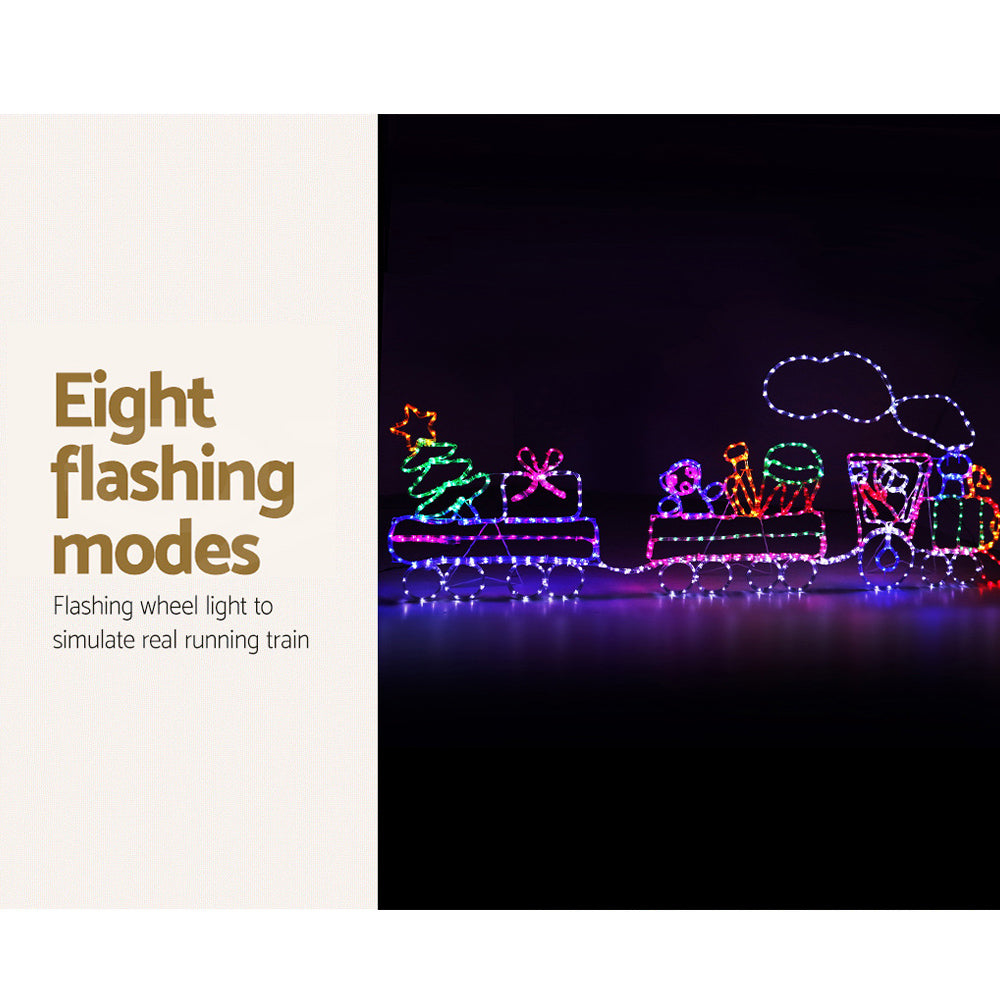 A beautifully illuminated 2.1M LED Rope Train with colorful lights, showcasing a festive Christmas decoration set.