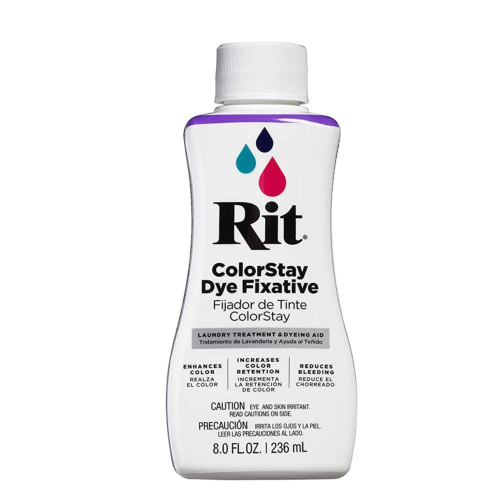 Rit ColorStay Dye Fixative 236ml bottle with vibrant colors and fabric dyeing supplies in the background.