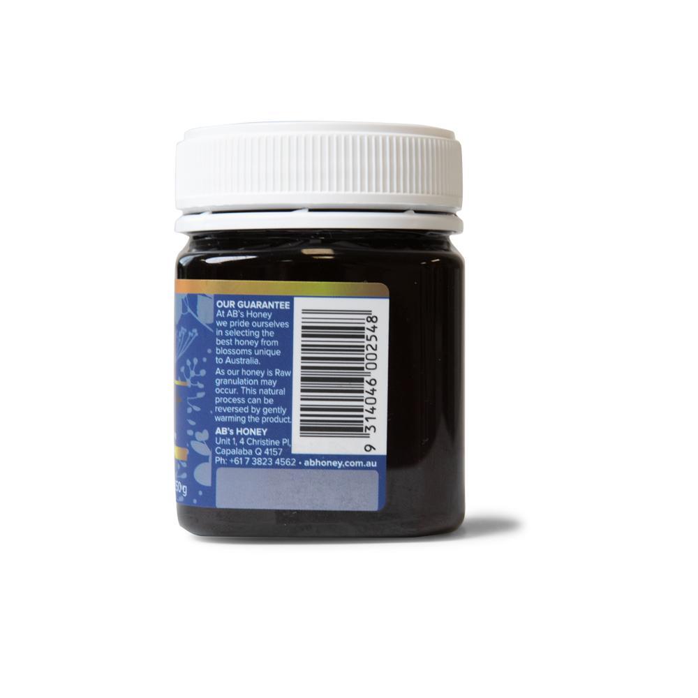 250g jar of MGO 100+ Australian Manuka Honey with a rich dark color, showcasing its pure and natural quality.