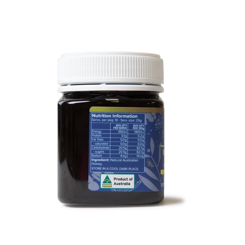 250g jar of MGO 100+ Australian Manuka Honey with a rich dark color, showcasing its pure and natural quality.