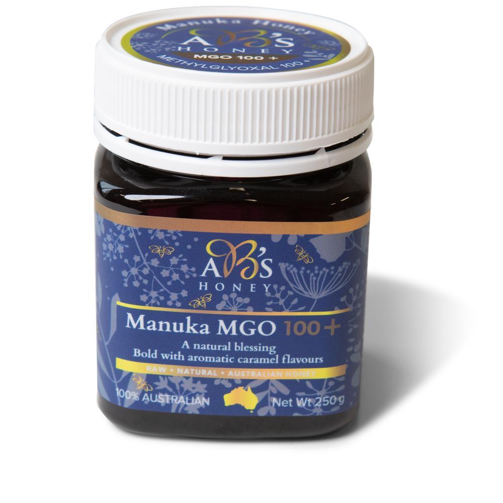 250g jar of MGO 100+ Australian Manuka Honey with a rich dark color, showcasing its pure and natural quality.