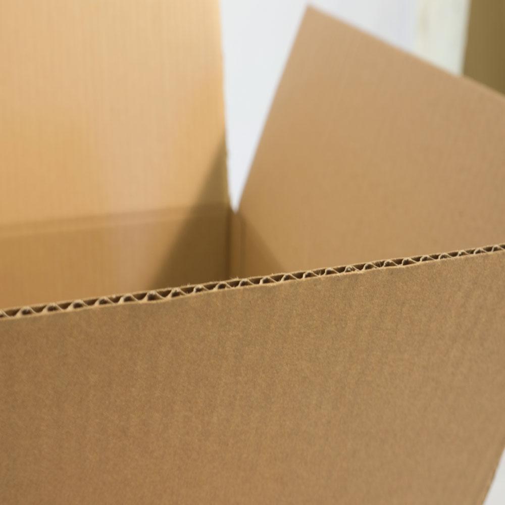 A stack of 25 cardboard boxes, each measuring 305x215x255mm, ideal for moving and storage, showcasing their lightweight and strong design.