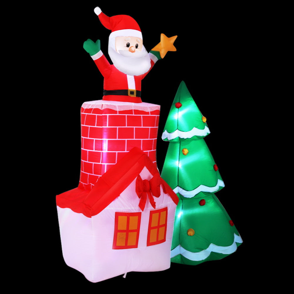 A vibrant 2.2M inflatable Santa in a chimney, surrounded by a colorful tree, perfect for Christmas decorations.