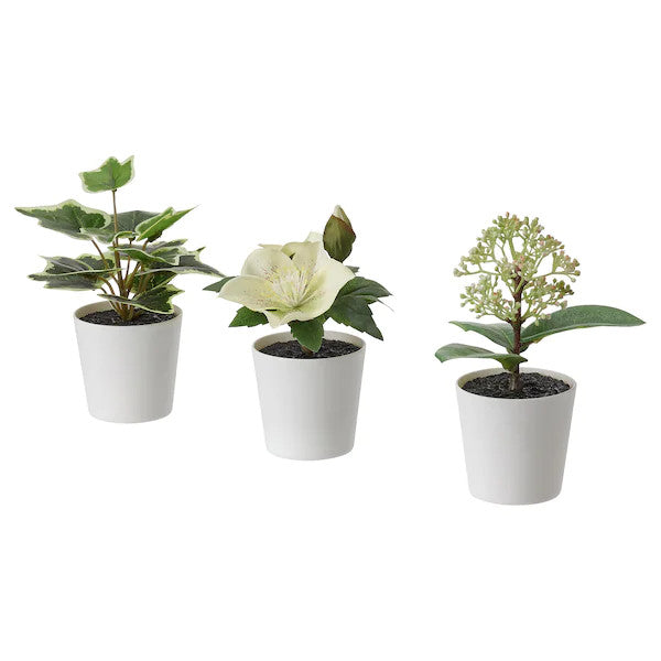 Three artificial potted plants in white plastic pots, showcasing lifelike leaves, perfect for home or office decor.