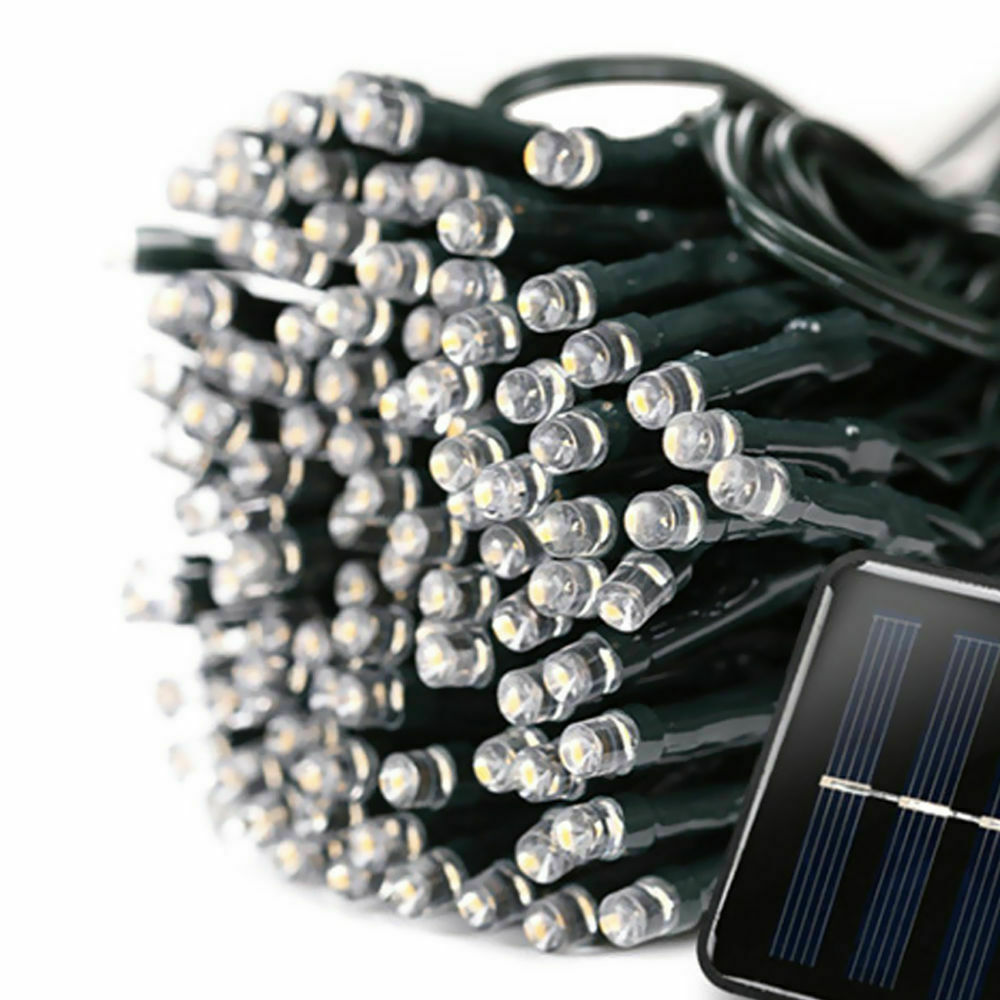 30M 300LED solar powered fairy lights with warm white glow, perfect for outdoor decoration in gardens and patios.