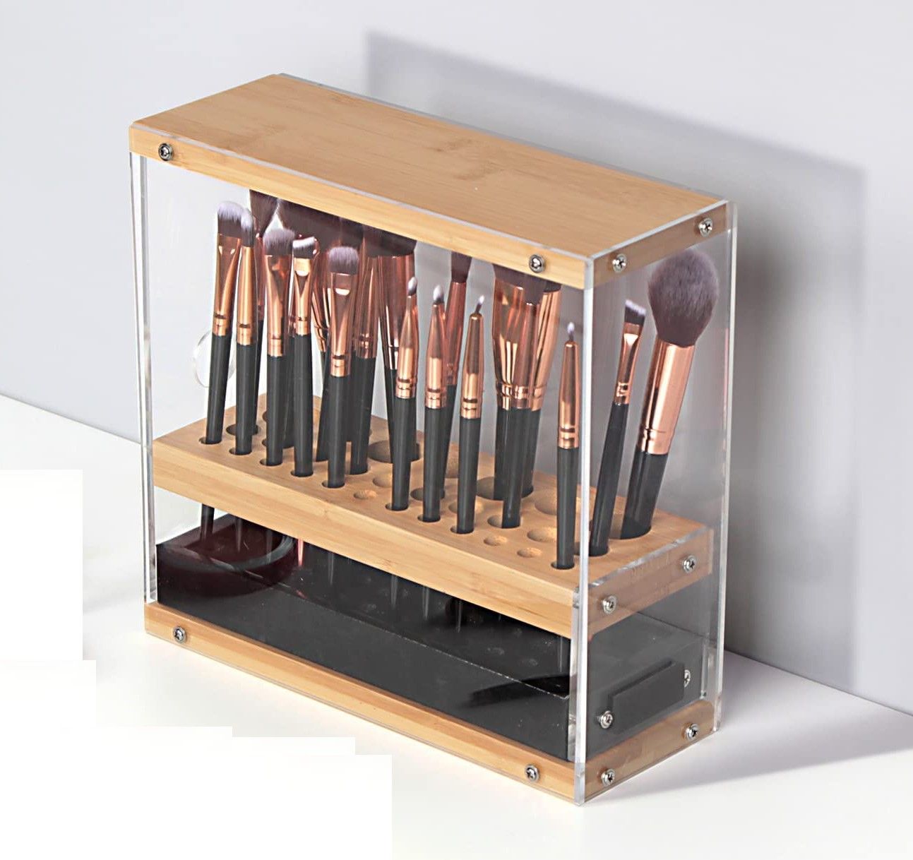 A stylish 31 holes acrylic bamboo brush holder organizer with a leather drawer, designed for beauty cosmetic display.