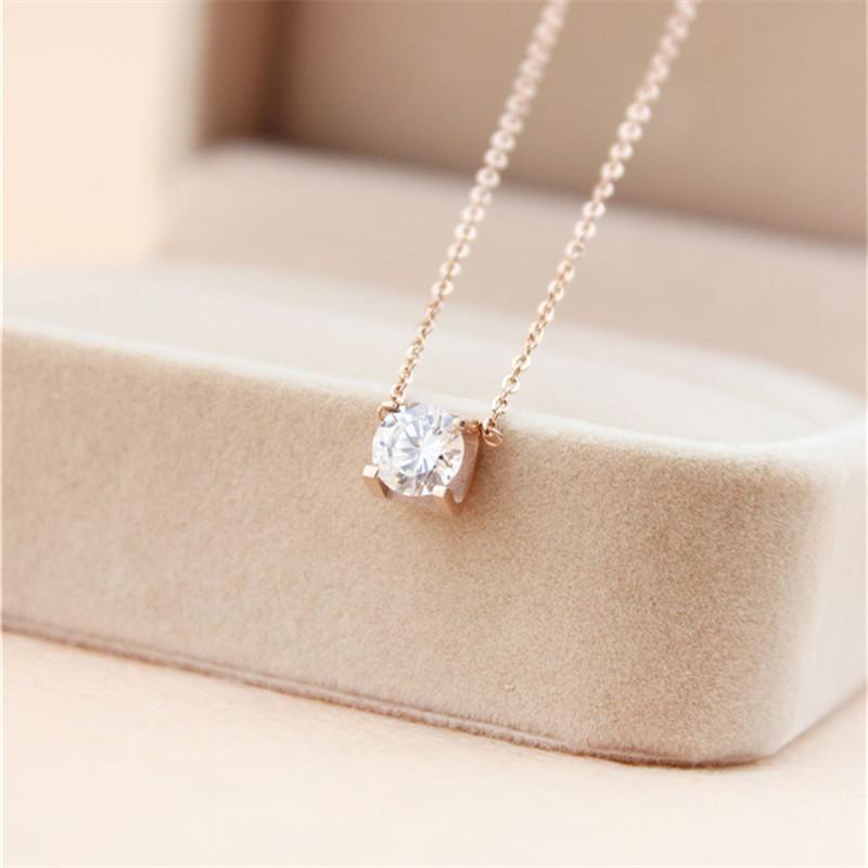 A beautiful 316L titanium steel pendant necklace featuring a big square diamond and a cute lucky charm, perfect for women's jewelry.