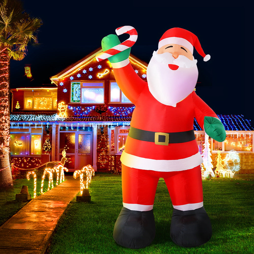 A 3-meter tall inflatable Santa Claus with a cheerful smile, illuminated by LED lights, standing in a festive outdoor setting.