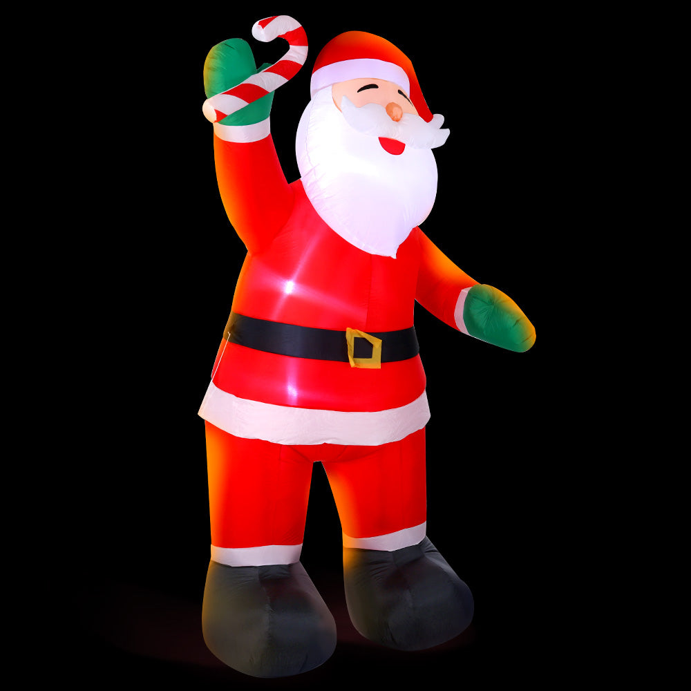 A 3-meter tall inflatable Santa Claus with a cheerful smile, illuminated by LED lights, standing in a festive outdoor setting.