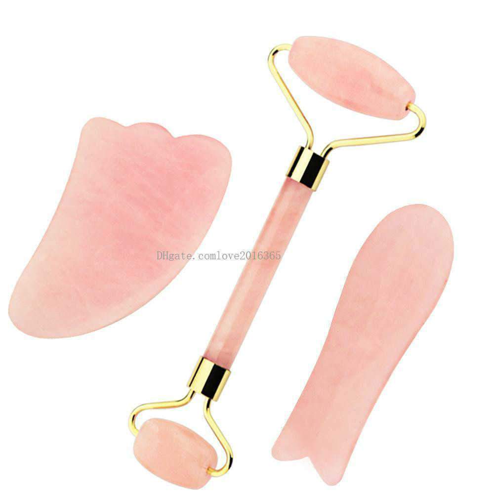 A set of three natural rose quartz Gua Sha tools for facial massage, showcasing their smooth edges and beautiful pink hue.