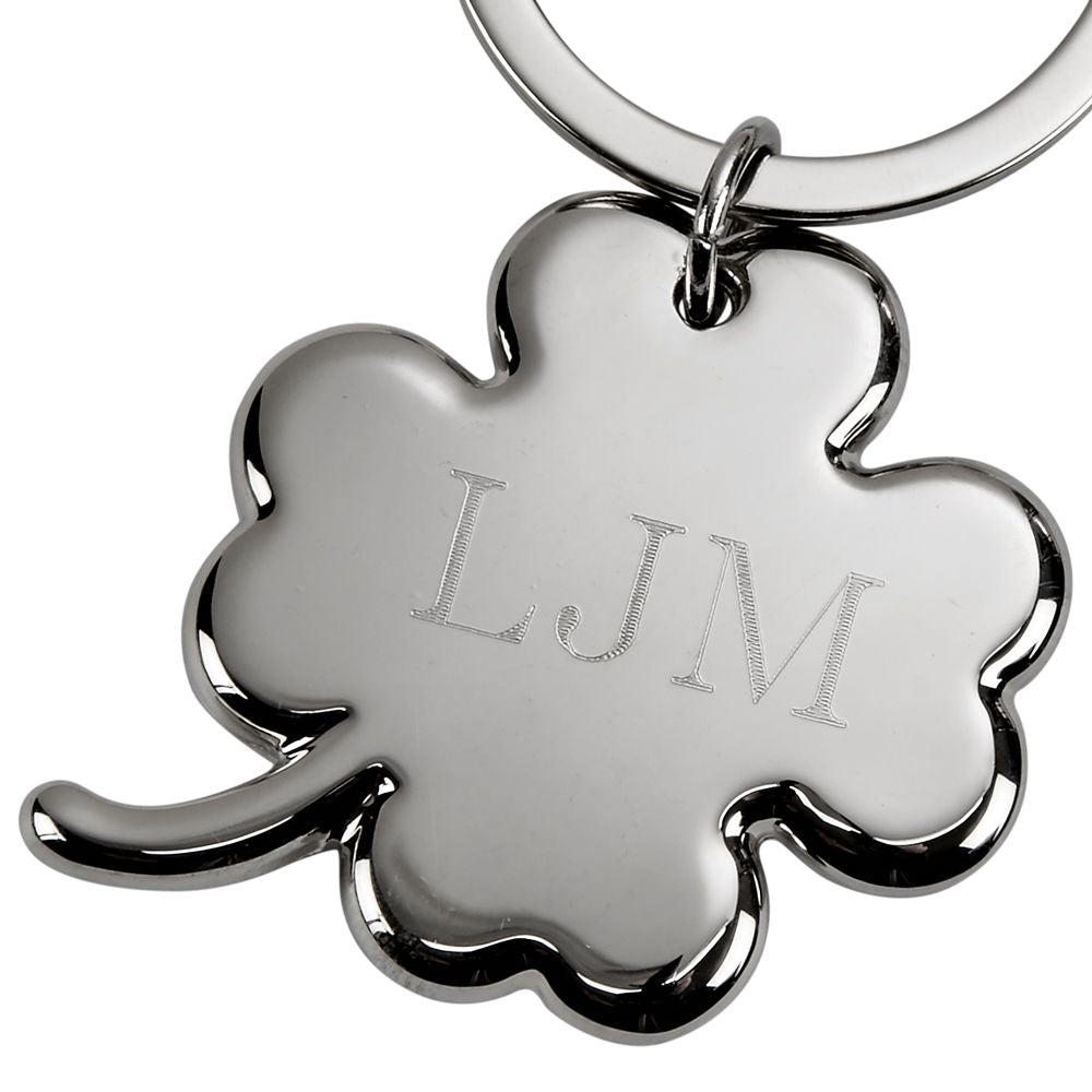 A nickelplated 4-leaf clover keychain, 3 inches long, featuring a polished clover charm and a sturdy keyring, presented in a black gift box.