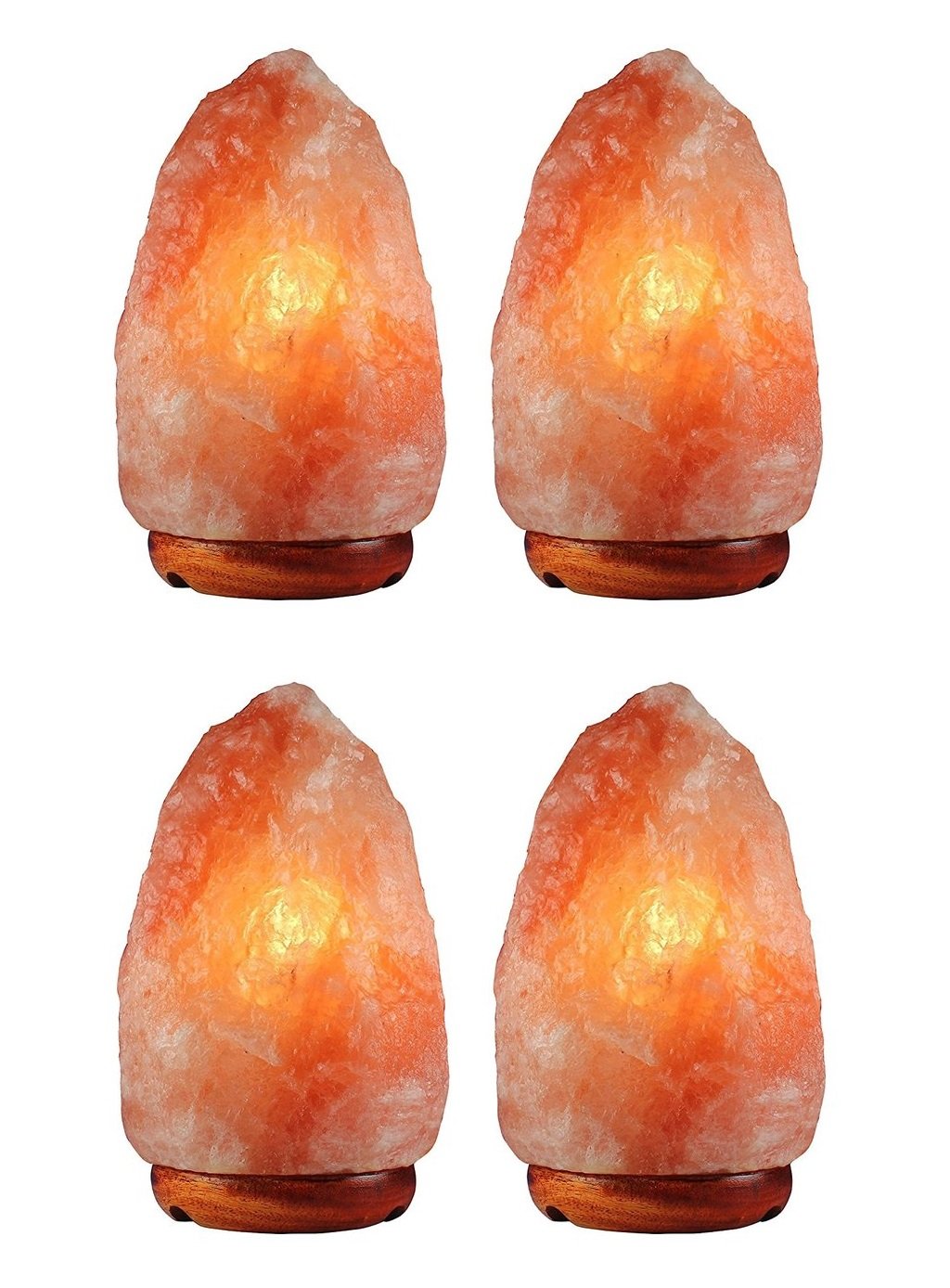 A set of four unique Himalayan salt lamps, each hand-carved with irregular shapes, showcasing hues of pink and orange, resting on polished wooden bases.