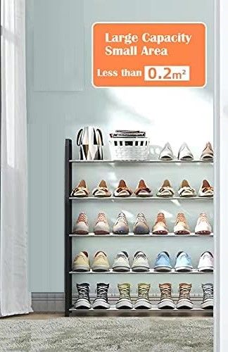 4 tier white shoe rack storage organiser with shoes neatly arranged on each tier, showcasing its spacious design and sturdy construction.