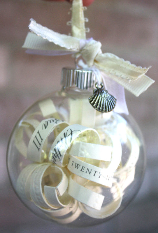 Four clear glass baubles, each 6cm in diameter, with silver caps, ideal for festive decorations and crafts.